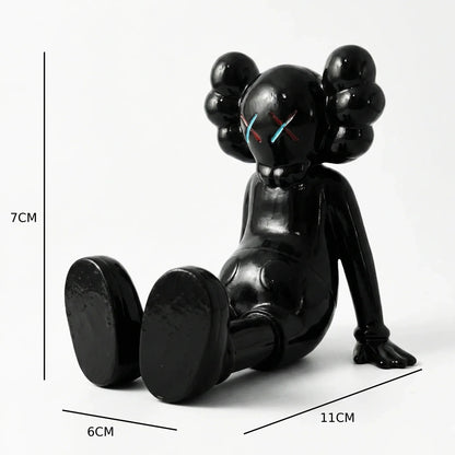 KAWS X Sitting Companion Miniature | Gloss Black Collectible | Archadia